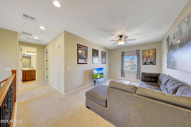 living room with light carpet and ceiling fan