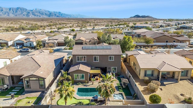 birds eye view of property featuring a mountain view