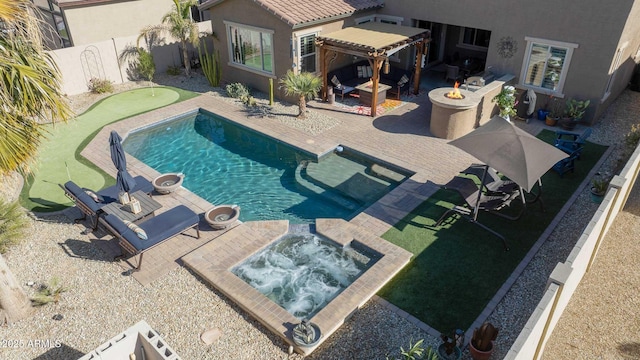 view of swimming pool featuring an in ground hot tub, a patio, and a fire pit