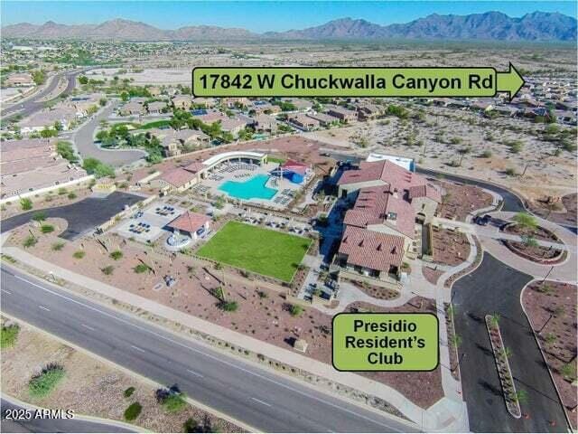 birds eye view of property with a mountain view