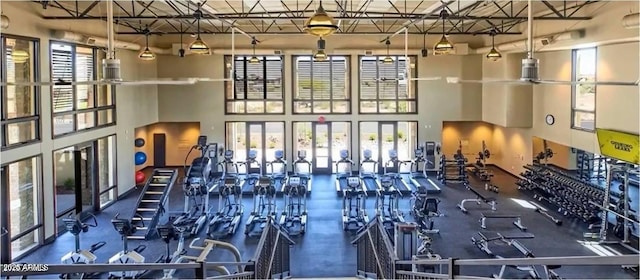 workout area with a high ceiling