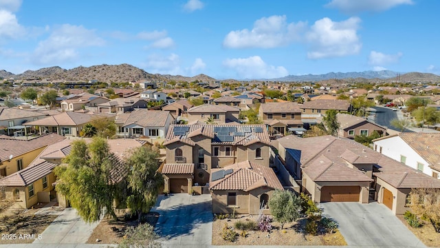 birds eye view of property with a mountain view