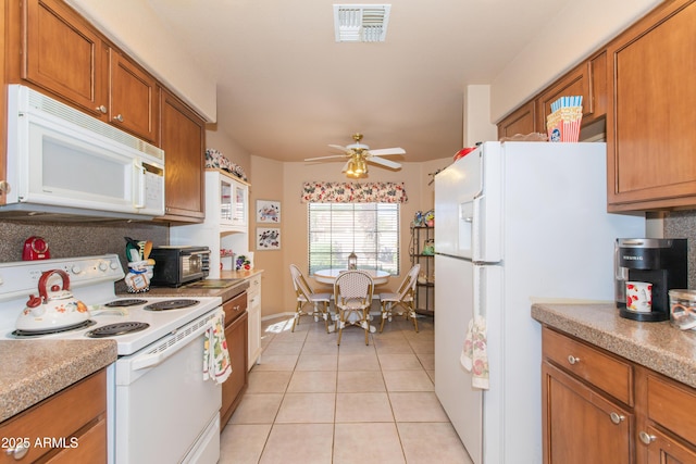 17342 E Quail Ridge Dr, Fountain Hills, AZ 85268 - kitchen featuring white appliances, light tile patterned floors, brown cabinets, ceiling fan, and light countertops