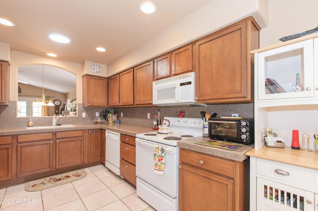 17342 E Quail Ridge Dr, Fountain Hills, AZ 85268 - kitchen with white appliances, brown cabinets, tasteful backsplash, a sink, and light tile patterned flooring