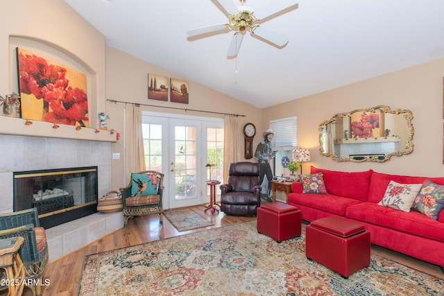 17342 E Quail Ridge Dr, Fountain Hills, AZ 85268 - living area with lofted ceiling, wood finished floors, a fireplace, a ceiling fan, and french doors