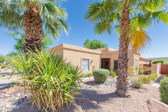 17342 E Quail Ridge Dr, Fountain Hills, AZ 85268 - pueblo-style house with stucco siding and fence