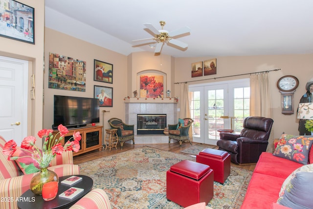17342 E Quail Ridge Dr, Fountain Hills, AZ 85268 - living room with french doors, wood finished floors, a ceiling fan, and a tiled fireplace