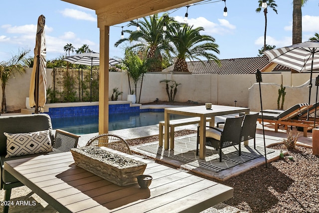 view of swimming pool with a patio area