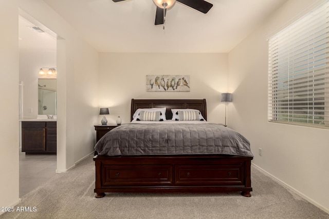 12109 W Tether Trl, Peoria, AZ 85383 - bedroom featuring light carpet, ensuite bath, and a ceiling fan