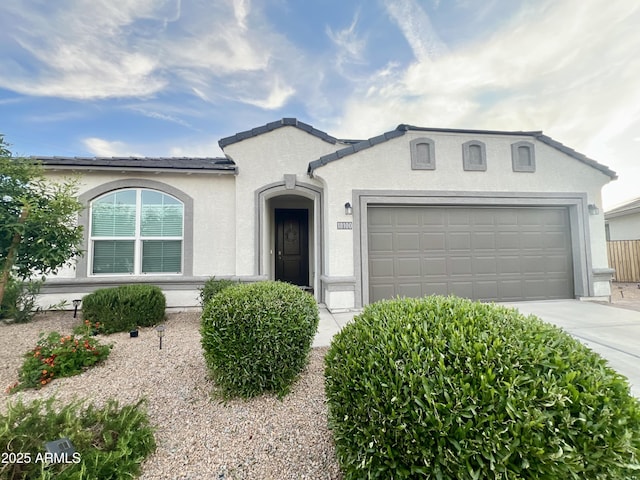 single story home with a garage, stucco siding, and driveway