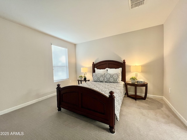bedroom featuring baseboards, light carpet, and visible vents