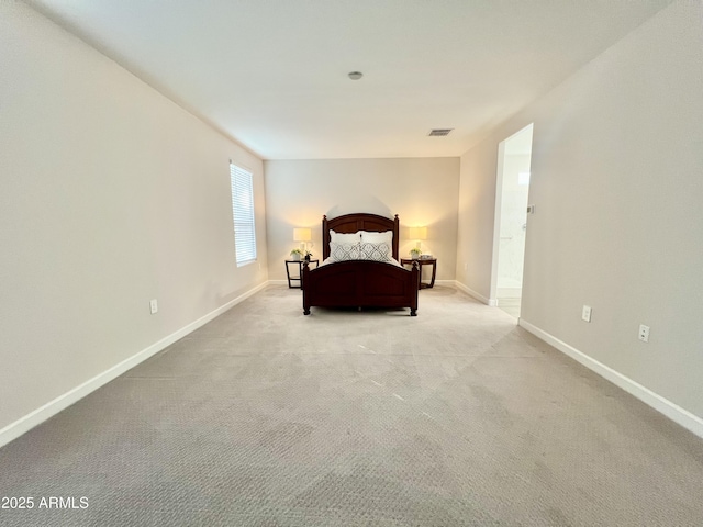 bedroom featuring light colored carpet, baseboards, and visible vents