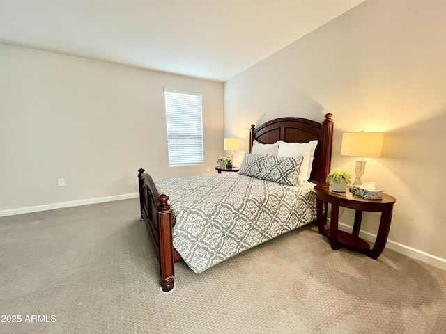 bedroom featuring baseboards and carpet