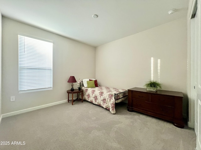 bedroom with baseboards and carpet floors