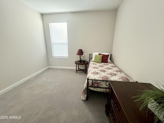 carpeted bedroom with baseboards