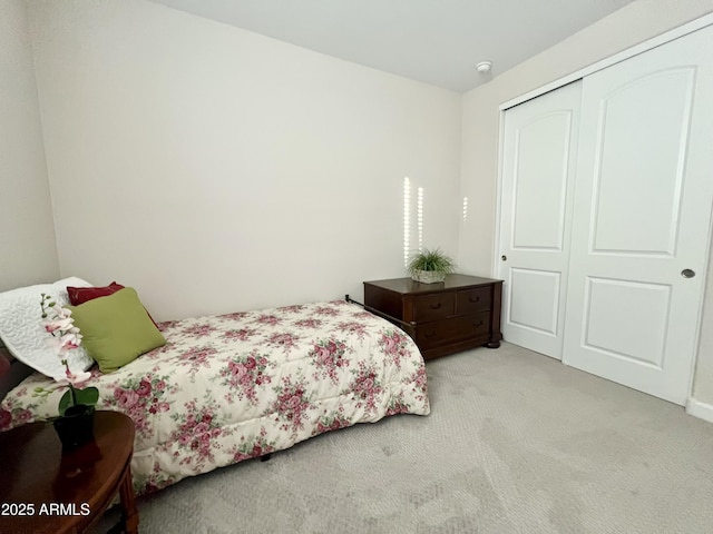 carpeted bedroom with a closet