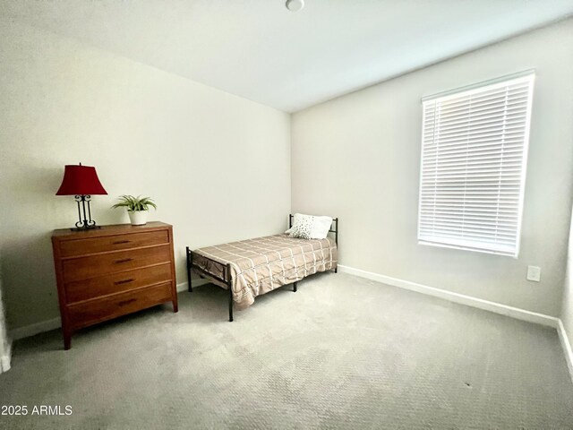 bedroom with baseboards and carpet flooring