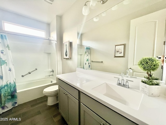bathroom featuring toilet, vanity, shower / bath combination with curtain, and wood finished floors