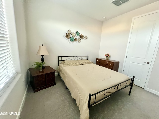 bedroom with visible vents and baseboards