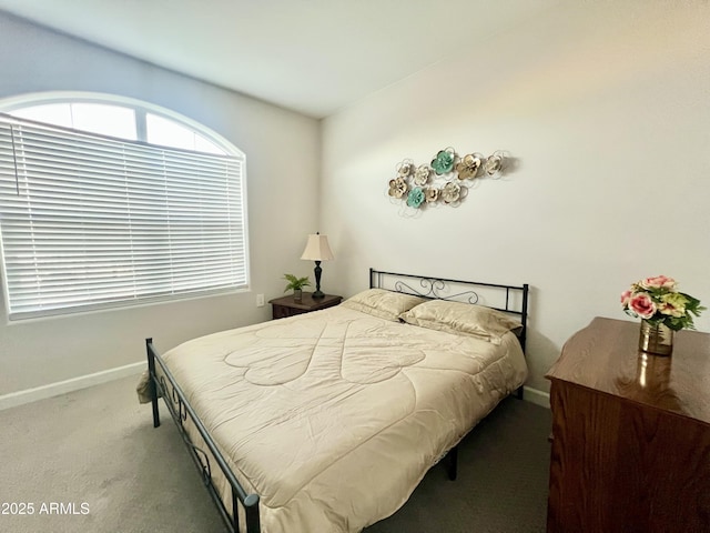 carpeted bedroom with baseboards