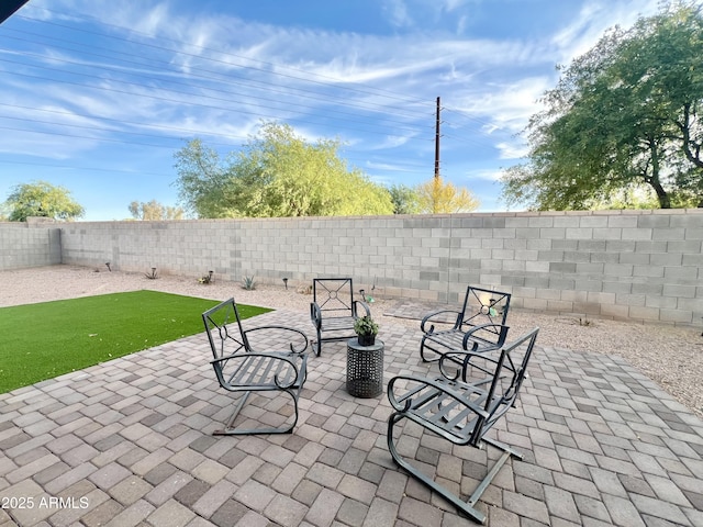 view of patio featuring a fenced backyard