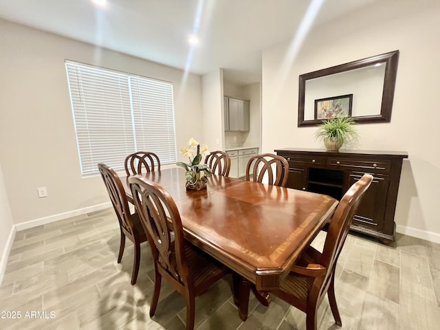 dining room with baseboards