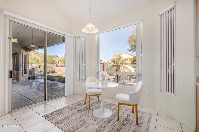 dining space featuring light tile patterned floors