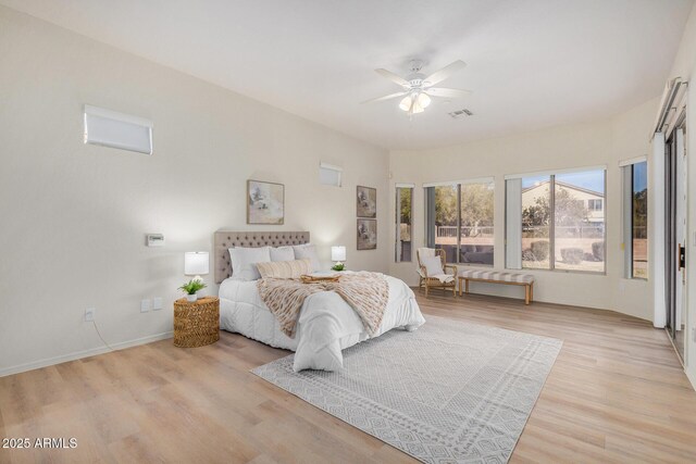 empty room featuring ceiling fan and light hardwood / wood-style flooring