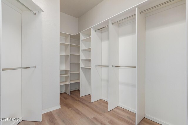 empty room featuring light hardwood / wood-style flooring and ceiling fan