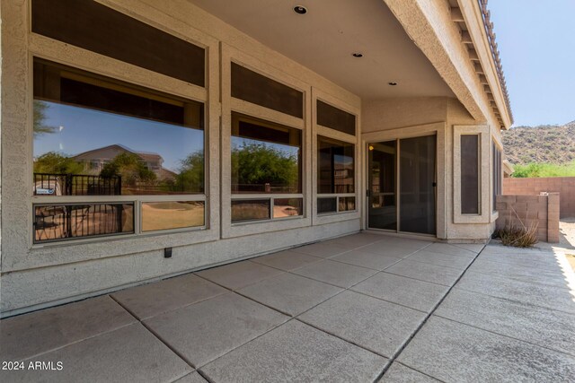 view of patio featuring a fenced in pool