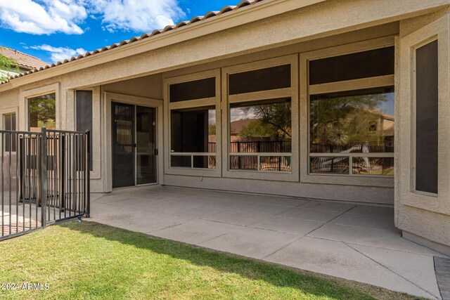 back of property featuring a fenced in pool and a yard