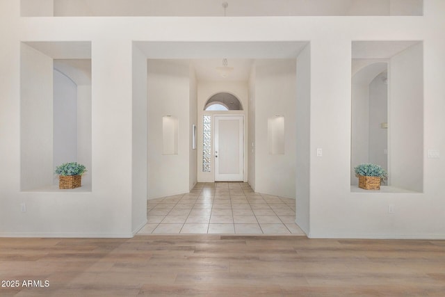 foyer with light wood-style floors