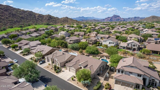 drone / aerial view featuring a residential view and a mountain view