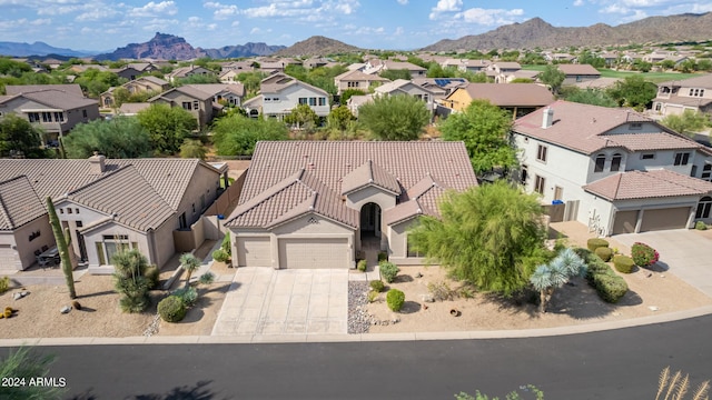 bird's eye view with a residential view and a mountain view