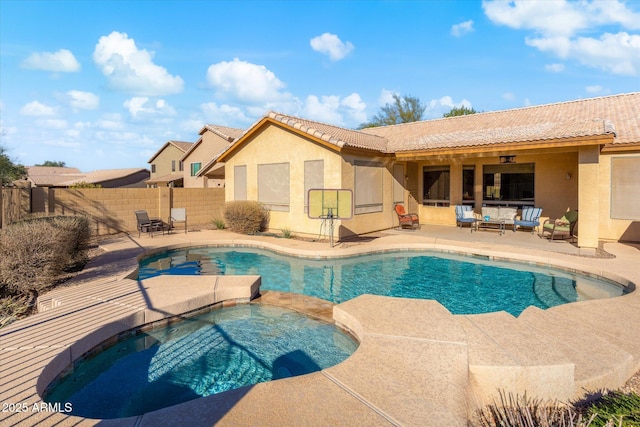 view of swimming pool featuring an outdoor hangout area, an in ground hot tub, and a patio area