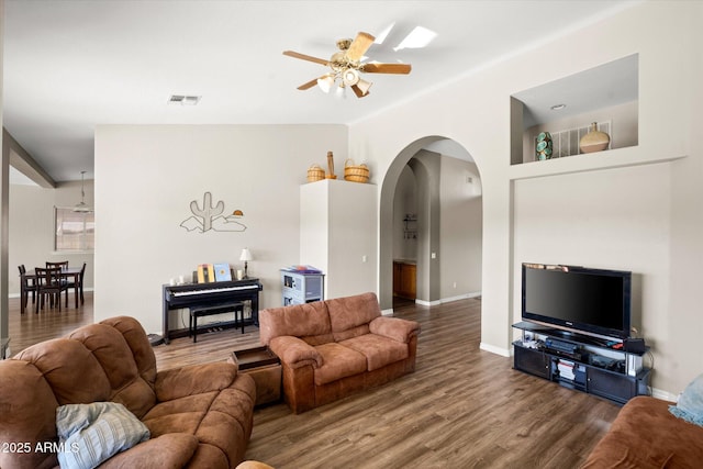 living room with ceiling fan and hardwood / wood-style floors