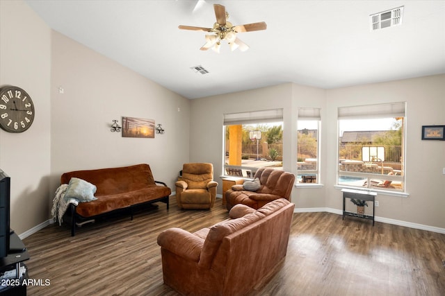 living room with ceiling fan and dark hardwood / wood-style floors