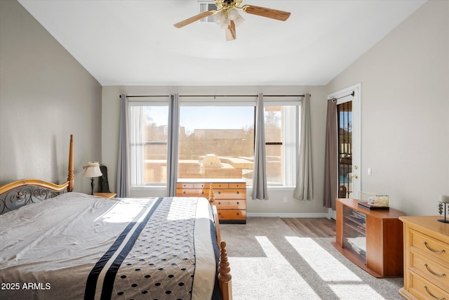 carpeted bedroom featuring ceiling fan and lofted ceiling