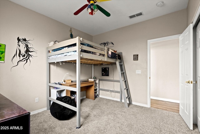 carpeted bedroom with ceiling fan