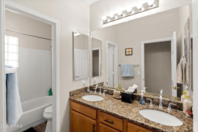 full bathroom with toilet, bathing tub / shower combination, and vanity