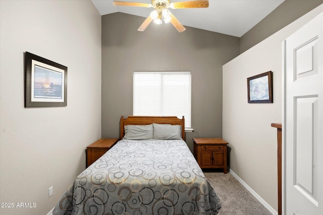 carpeted bedroom featuring lofted ceiling and ceiling fan