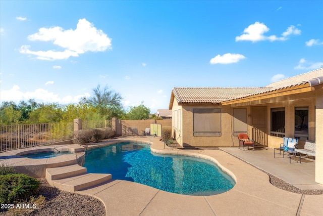 view of swimming pool with a patio area and an in ground hot tub