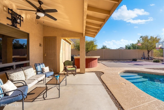 exterior space featuring ceiling fan, a pool with hot tub, and outdoor lounge area