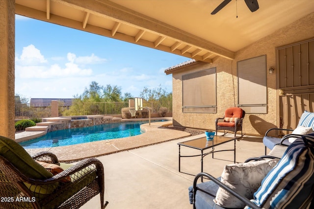 view of pool with ceiling fan, a patio, and an in ground hot tub