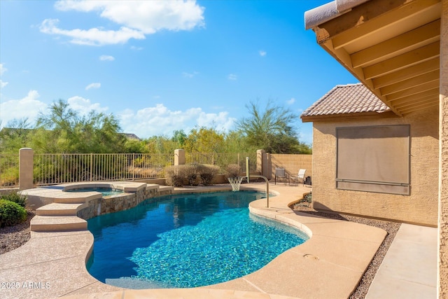 view of swimming pool featuring an in ground hot tub and a patio area