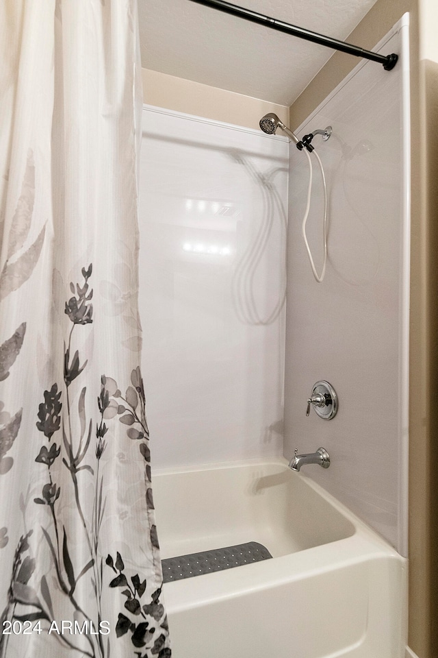 bathroom featuring shower / bath combination with curtain