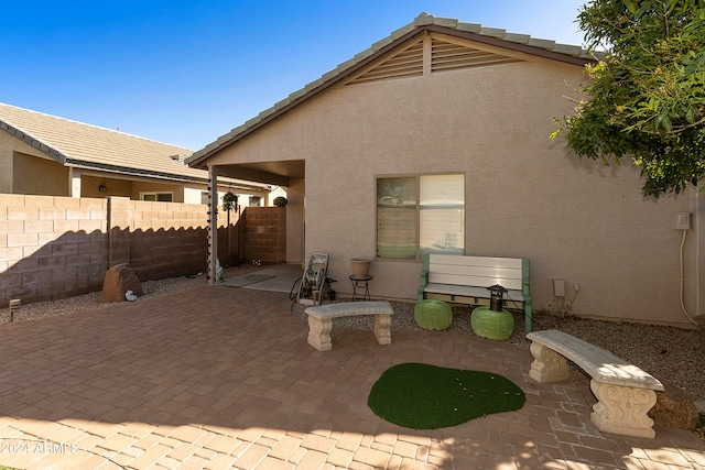 rear view of house featuring a patio