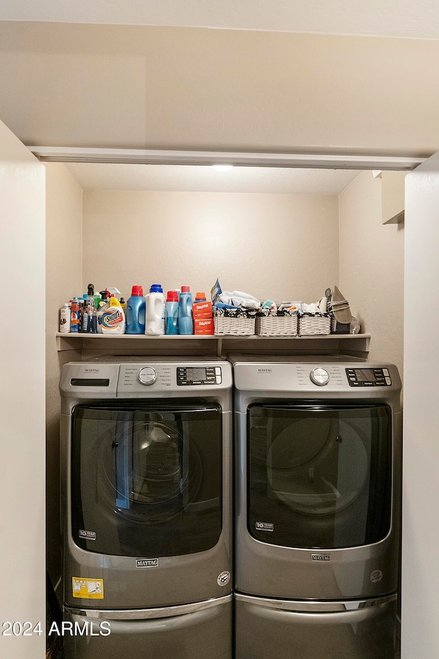 washroom with washing machine and dryer