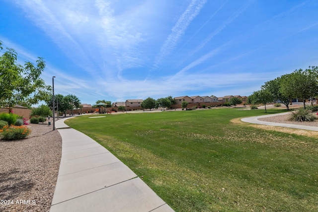 view of home's community featuring a yard