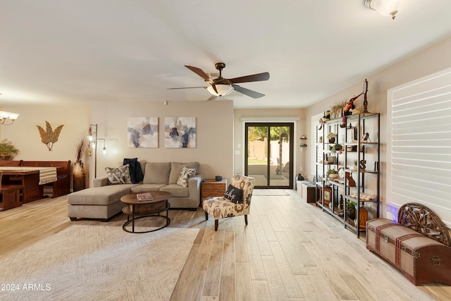 living room featuring light wood-type flooring and ceiling fan